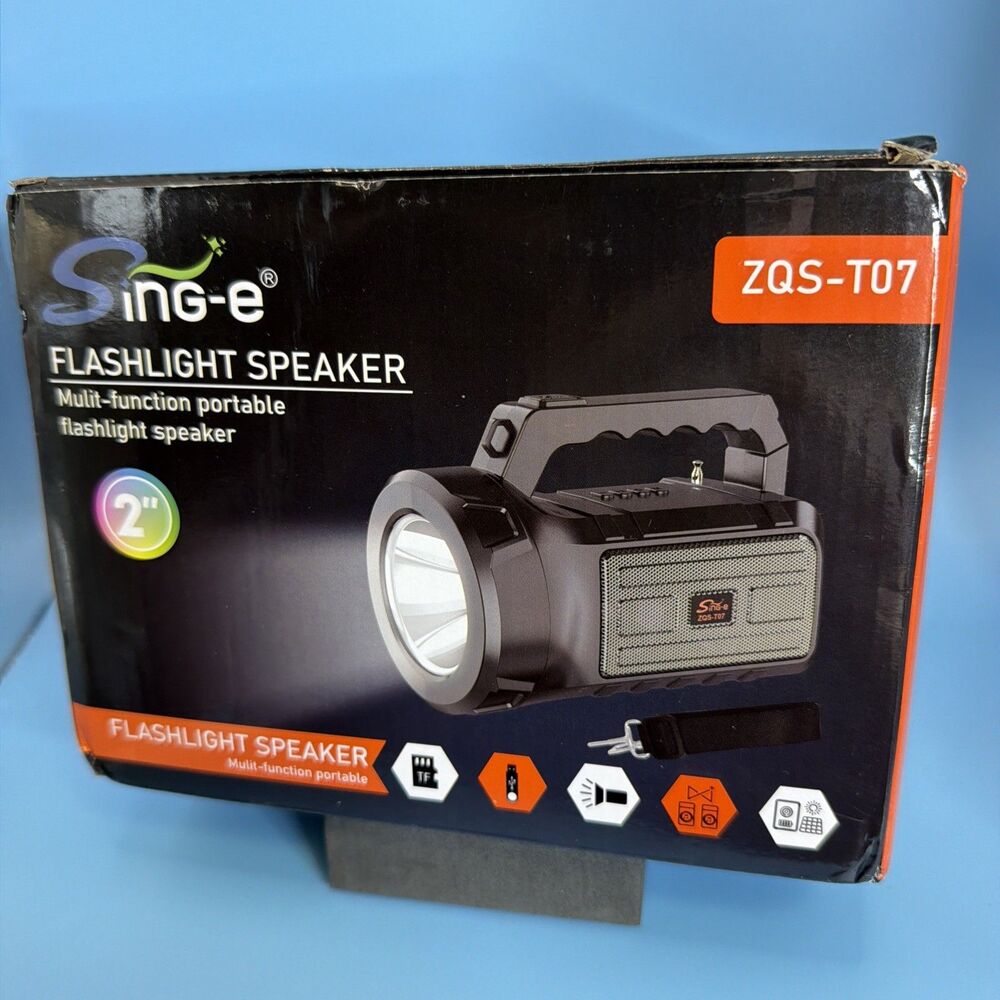 NEW - Black Solar Flashlight And Speaker With 1800mAh Battery, Shoulder Strap.